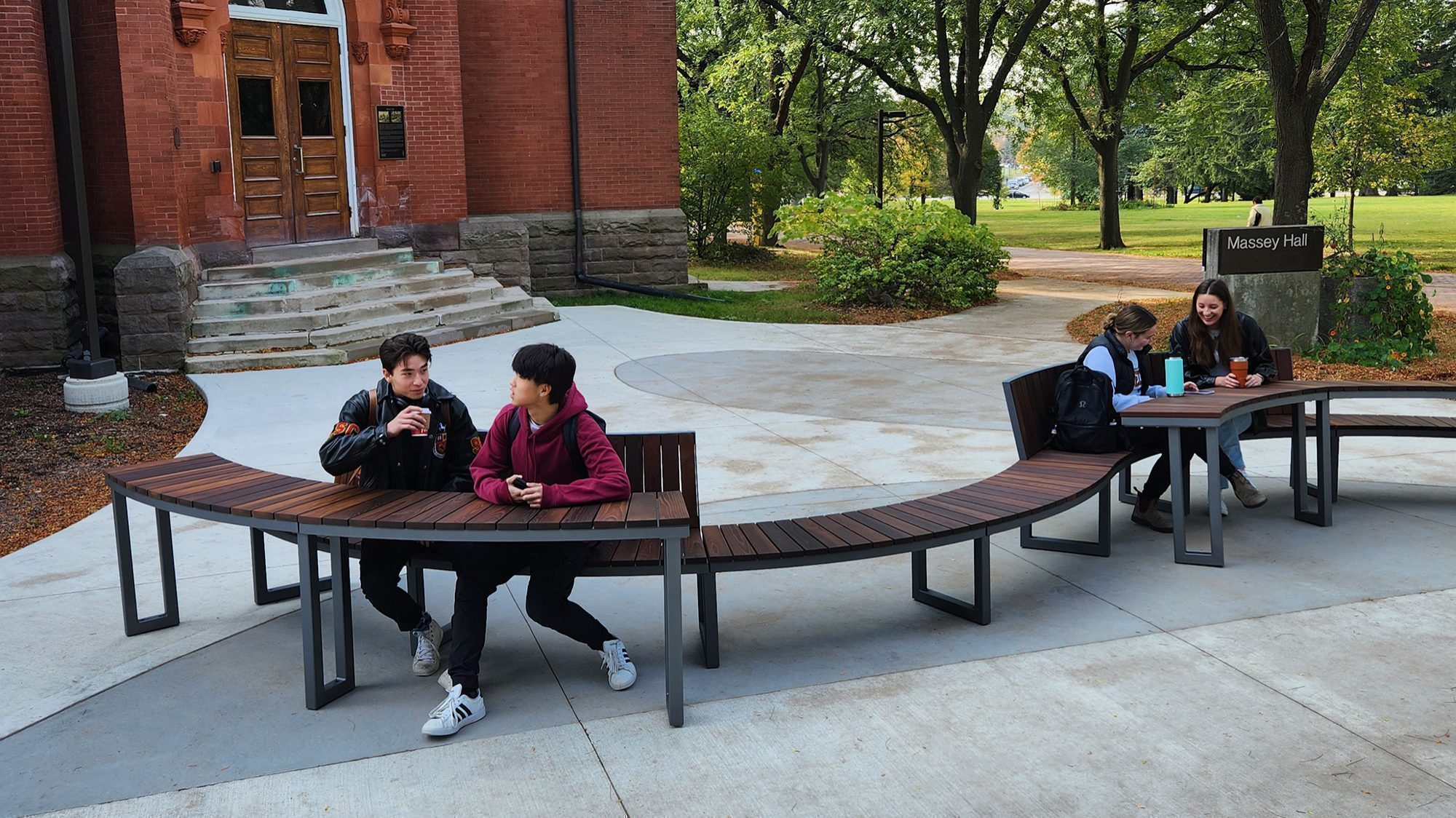 Students enjoying the outdoors on Ogden tables and seating