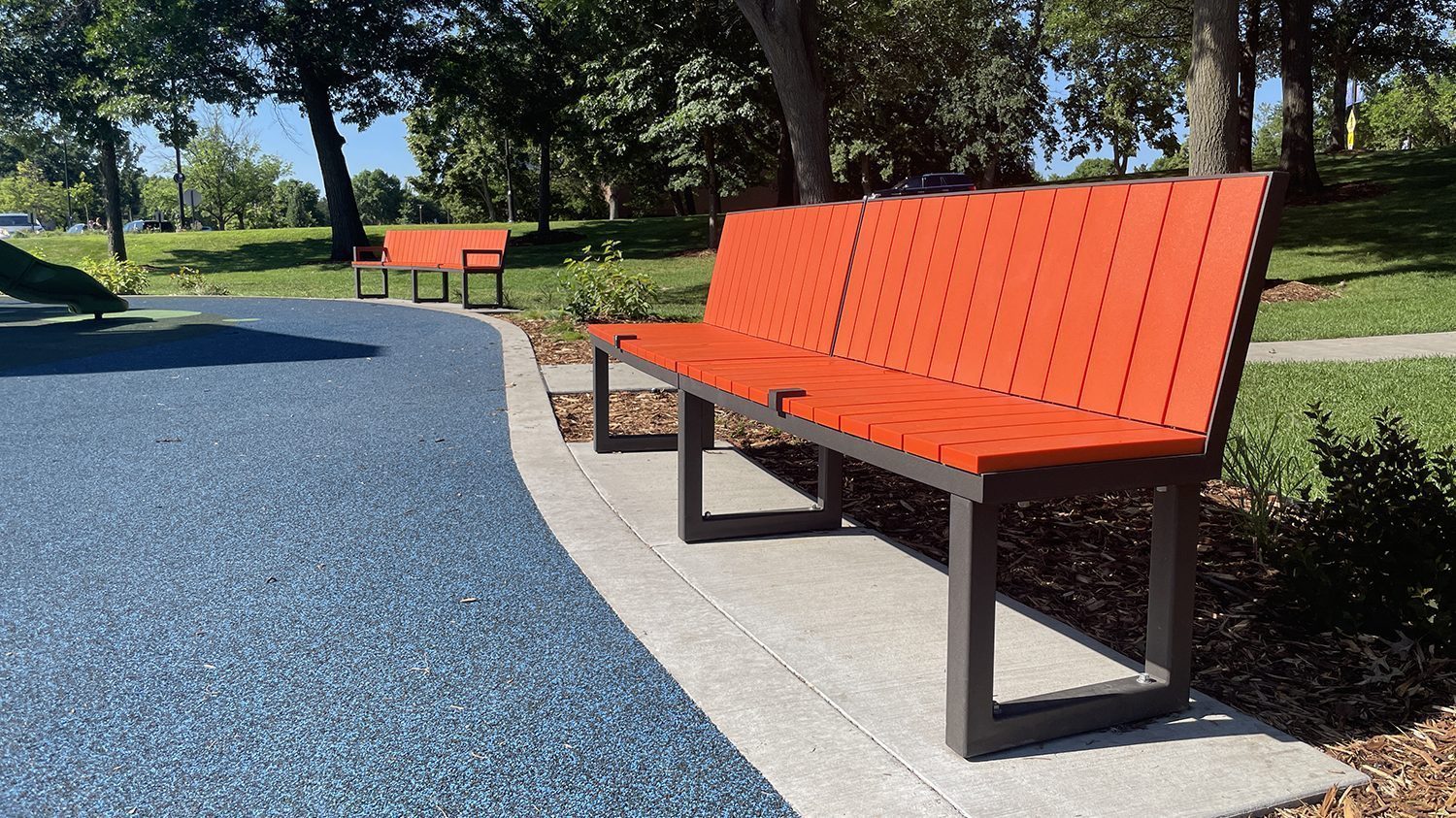 Backed Ogden Benches, HDPE Orange at shoreview commons park