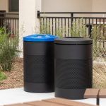 600 Waste and Recycle Containers painted black finetex on a patio next to a garden