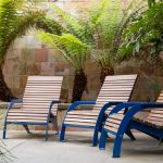 720 Chairs with Ipe Wood on school campus with green palm trees