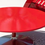 Close-up of Battery 36in lounge table in powdercoat red