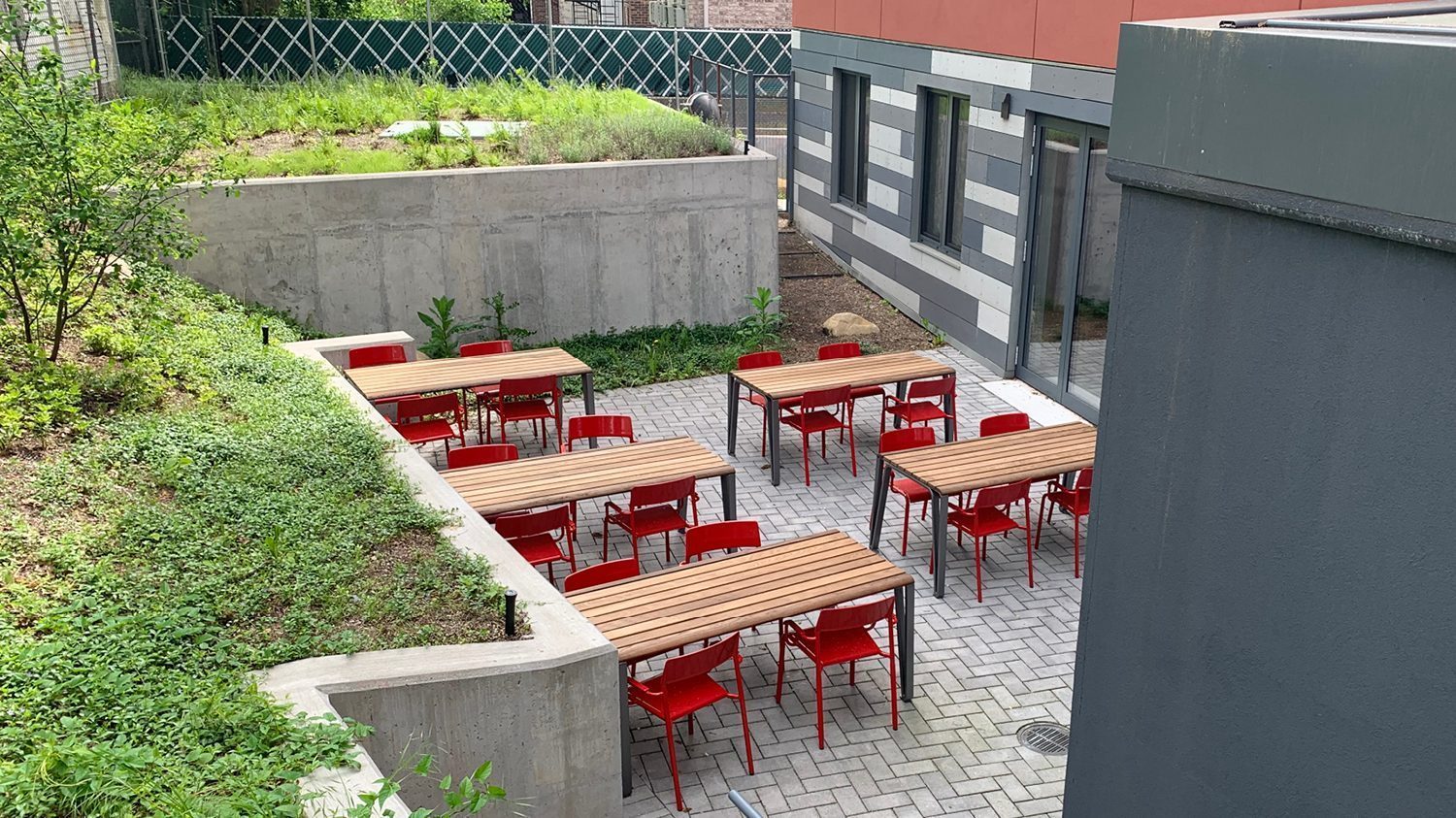 Iconic Standard Tables with Red Foro Chairs on outdoor patio