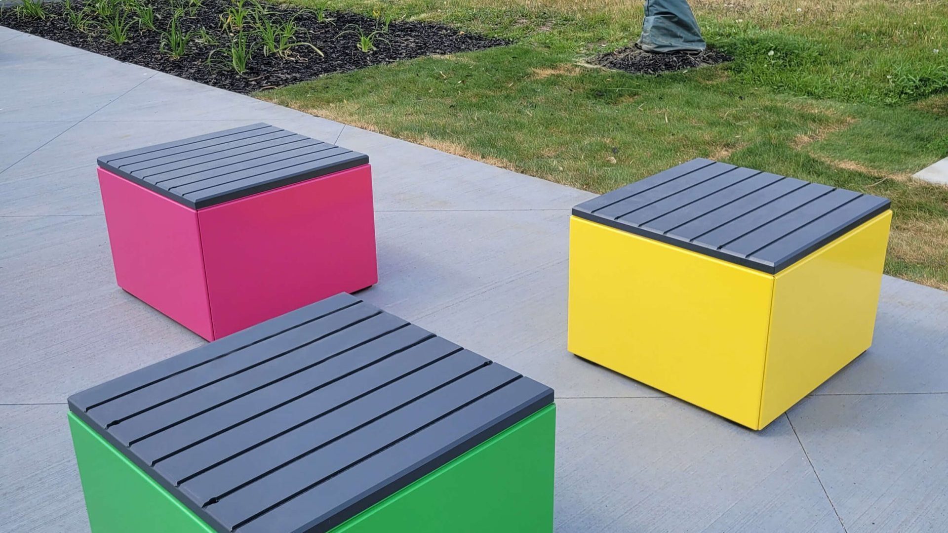 Brightly painted Pixel Blocks with HDPE Tops in park setting